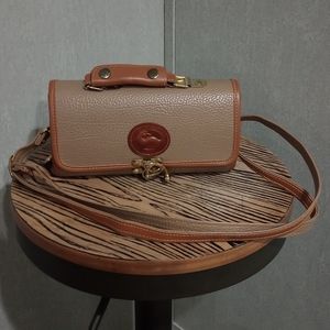 Beige color purse, hardware has wear on it, fair condition.